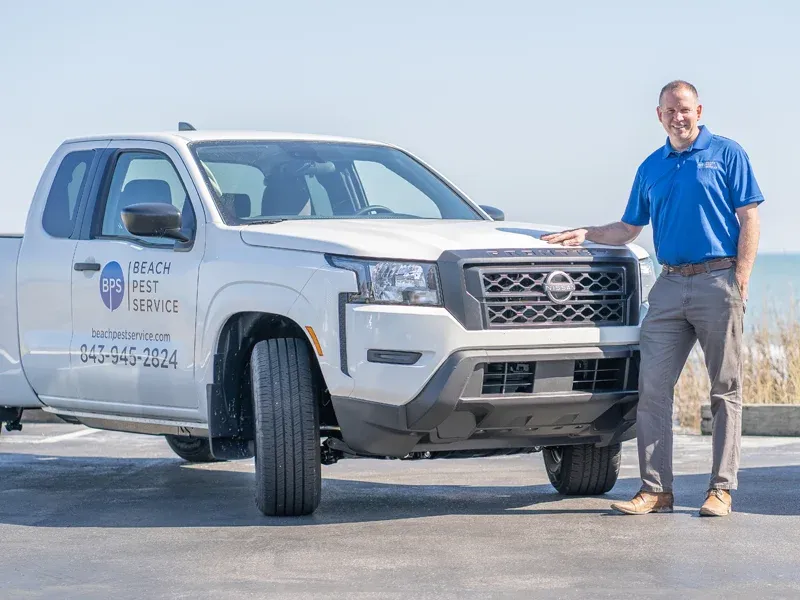 Beach Pest Owner standing next to truck